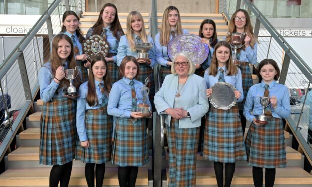 The Falkirk Junior Gaelic Choir with their winning haul of trophies from two competitions in the Perth Concert Hall. Image: Sandy McCook/ DC Thomson.