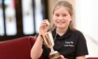 The 10-year-old fought off stiff competition from 11 young singers to win the Mrs Roderick B Munro Trophy and the coveted Gold badge. Image: Sandy McCook/ DC Thomson.