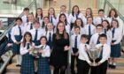 Sir E Scott School Junior Choir with their conductor Jane Macdonald and their two trophies from fluent choral singing on Tuesday afternoon. Image: Sandy McCook/ DC Thomson.