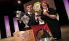 Jonathan Fairgrieve of Lewis, winner of the Silver Pendant, pictured with his winning trophies and Rena Gertz of Prestonpans who won the ladies event in the Perth Concert Hall. Image: Sandy McCook/ DC Thomson.