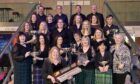 Avril Allen, conductor of the Back Gaelic Choir from Lewis with their trophies. Image: Sandy McCook/ DC Thomson.