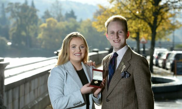 Traditional Ladies Gold Medal winner Alice Nic'a'Mhaoilein of Point Lewis with double Gold Medal winner Ruaridh Gray of South Uist. Image: Sandy McCook/ DC Thomson.
