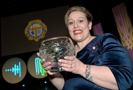 Kerrie Kennedy, the Gaelic and music tutor of the Aberdeen Gaelic Choir with the John MacLeod, Carloway and Edinburgh Trophy for the highest marks in Gaelic in the area choirs Puirt-a-beul competition. Image: Sandy McCook/ DC Thomson.