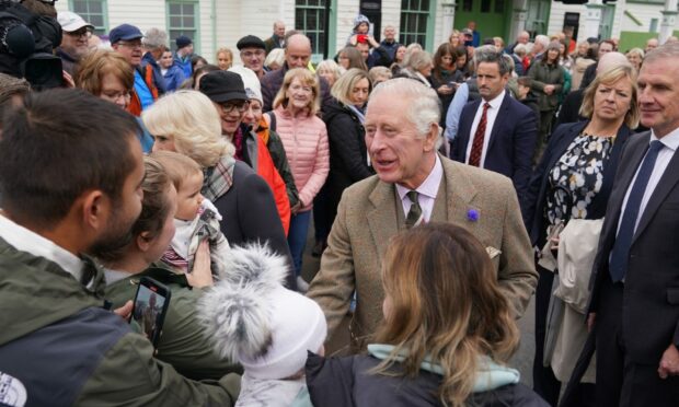 King Charles III and the Queen Consort meet members of the public in Ballater on Tuesday.