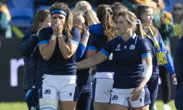 Scotland's Emma Wassell and Hannah Smith console each other at the end of the loss to Australia. Image: PA.