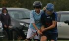 Badenoch Ladies' Rhona McIntyre, right, in action against Skye's Rhianna Kirk.