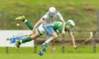 Skye's James Pringle in action against Beauly's Angus Renwick. Image: Neil Paterson