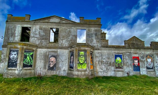 The Addams Family and Dracula have been painted onto the Shetland building. Photo: Shetland News
