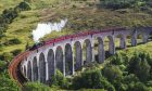 Jacobite steam train crossing the Glenfinnan Viaduct.
