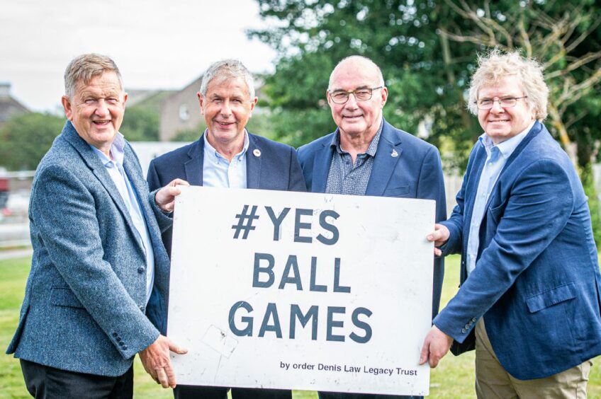 Council co-leaders Alex Nicoll of the SNP (left) and Liberal Democrat Ian Yuill (right) at the site of the Tillydrone Cruyff Court. It's to be named after former Dons skipper Willie Miller (centre left) and is funded by the Denis Law Legacy Trust. David Suttie (centre left) is a trustee of the charity. Image: Wullie Marr/DC Thomson.