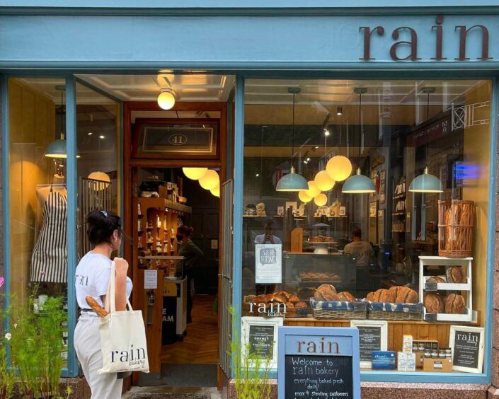 Rain Bakery storefront featuring tote bag and front sign, Fort William
