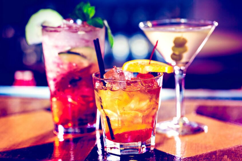 Colorful cocktails on the bar table.