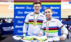 Great Britain's Neil Fachie piloted by Matt Rotherham sign the Santini rainbow jersey after winning gold.