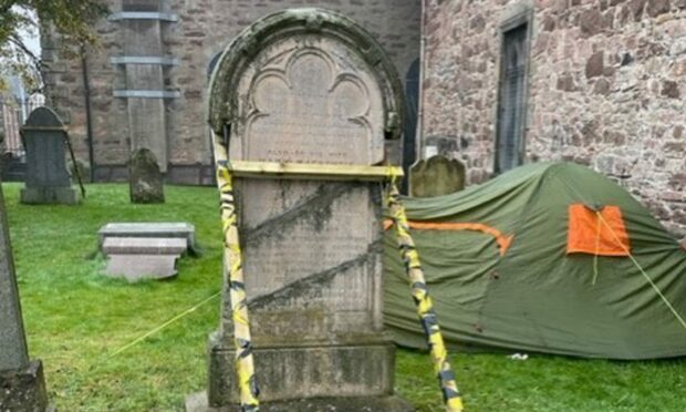 Graffiti, a camper and falling gravestones are impacting on a church in Inverness. Image: Malcolm MacCallum.