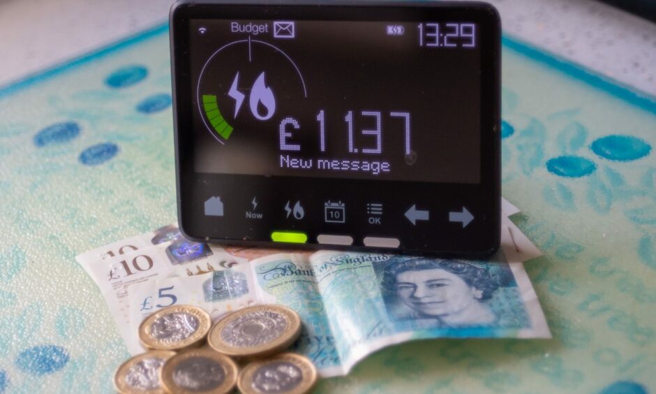 A smart metre and some cash on a counter