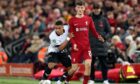 Lewis Dobbin of Derby County and Calvin Ramsay of Liverpool
in the EFL Carabao Cup 3rd Round clash at Anfield.
