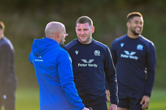 Scotland head coach, Gregor Townsend speaks with Finn Russell during training at Oriam.