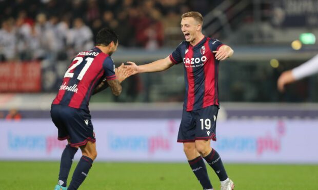 Lewis Ferguson celebrates after scoring for Bologna in Serie A. Image: Shutterstock.