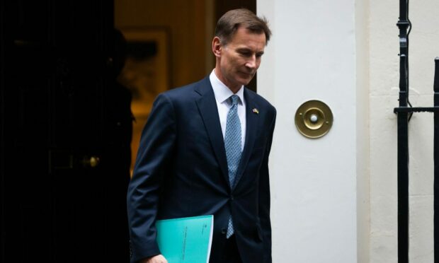 Chancellor Jeremy Hunt leaves Downing Street for the Commons. Image: Shutterstock.