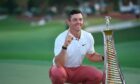 Rory McIlropy with the ever-imposing DPWT title trophy.