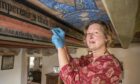 Painting specialist, Karen Dundas was brought in to do the work. Image: National Trust for Scotland.