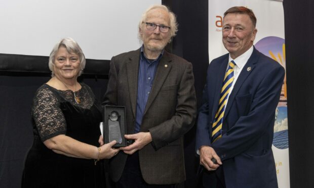 AREG founding chair Jeremy Cresswell was honoured, pictured with current chair Jean Morrison and AREG director Gordon McIntosh. P&J Live.