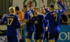 Cove Rangers players congratulate Connor Scully on his opening goal against Queen's Park. Image: SNS
