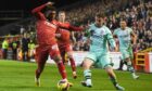 Aberdeen's Jayden Richardson and Hibs' Marijan Cabraja during the 4-1 win at Pittodrie.