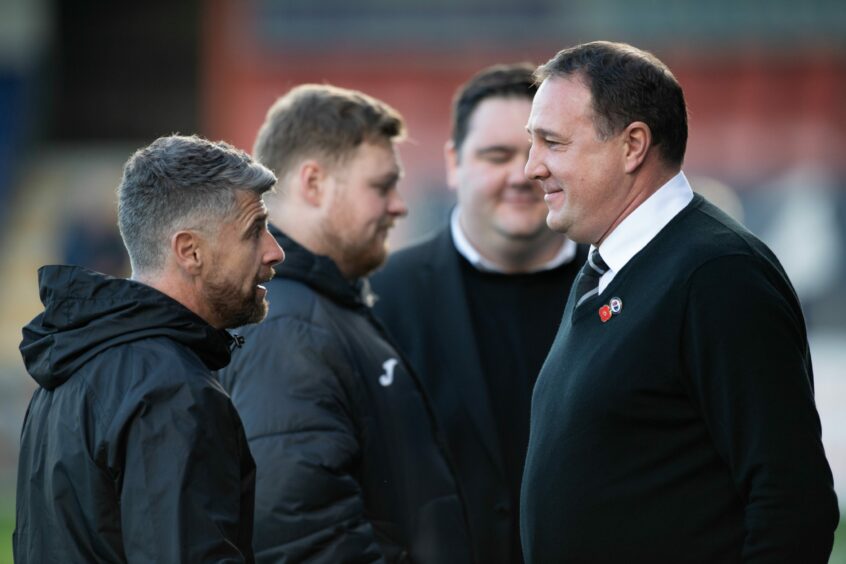 Malky Mackay in discussion with St Mirren boss Stephen Robinson