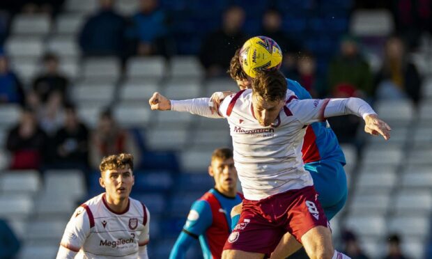 Arboath's Michael McKenna wins this header against Caley Thistle. Images: Roddy Scott/SNS Group