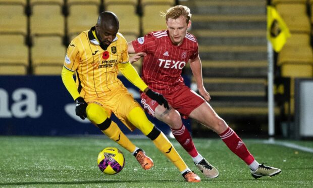 Dylan Bahamboula and Liam Scales in action during the cinch Premiership match between Livingston and Aberdeen at the Tony Macaroni Arena on Tuesday. Image: SNS