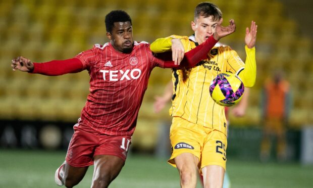Duk and James Penrice in action during Aberdeen's trip to Livingston in November. Image: SNS