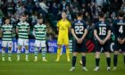 The Celtic and Ross County players observe a minute silence for Remembrance Day before Saturday's game. Image: SNS