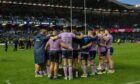 The Scots huddle in disappointment after the loss at Murrayfield.
