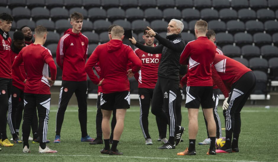 Jim Goodwin chats to the Aberdeen players during the winter training camp in Atlanta.