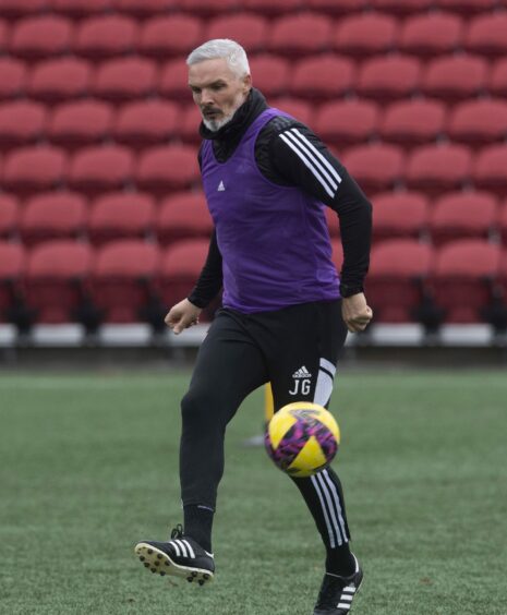 Aberdeen manager Jim Goodwin with the ball during Dons training in Atlanta.