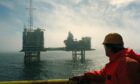 A worker looks out at BP's ETAP platform in the North Sea.