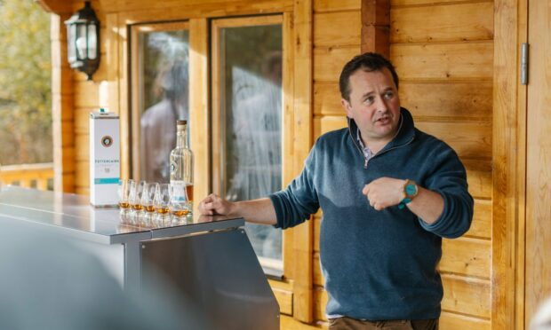 Whyte and Mackay's master whisky maker Gregg Glass with the new 18-year-old Fettercairn Distillery whisky. Image: Fettercairn Distillery/Grant Anderson