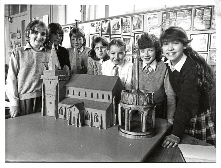 A group of girls from Broomhill School with models of St Machar church and Mercat Cross