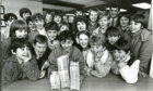 1986 - Broomhill youngsters get their hands on some serious money at Clydesdale Bank’s Holburn Street branch.
