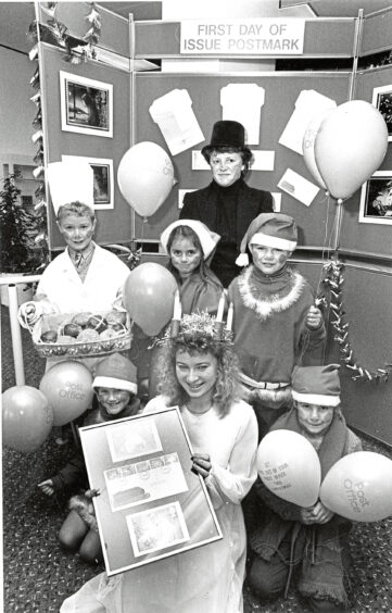 1987 - Queen of Light Debbie Rushforth brought her attendants along to help launch the new series of Christmas stamps, at the new St Nicholas Centre post office.