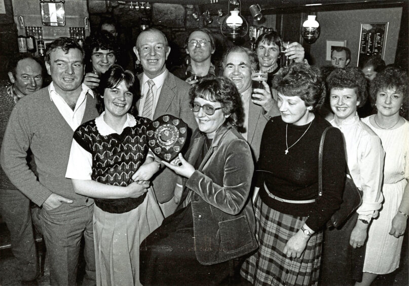 1984 - The Bieldside Inn celebrate with a third successive trophy for being the group to collect the most money for the Royal National Institute for the Blind.