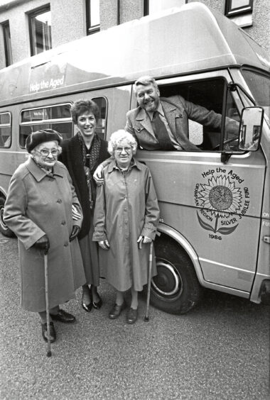 1990 - Residents of Ruthrieston House receive a £400 cheque from the Clyde Platform charity committee to provide a radio in their minibus.