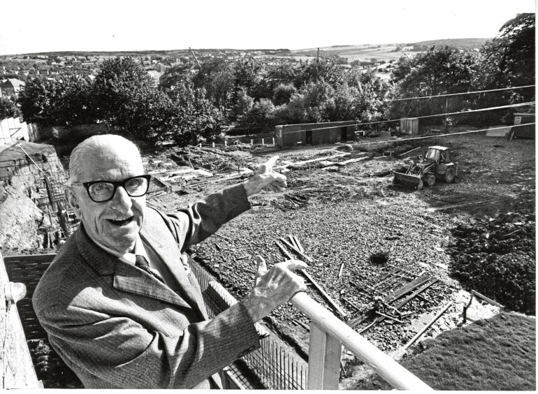 1984 - Norman Ross, 80, a resident at Broomhill Old People's Home, points out where the former Ruthrieston Station used to stand and where Ruthrieston House is being built.