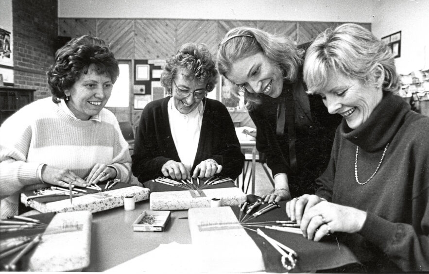 1988 - Under the watchful eye of Dutch born tutor Frea Kynaston beginners in bobbin lace making go over the basic stitches at Ruthrieston Community Education Centre.