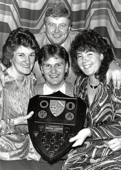 1988 - Winners of the Aberdeenshire Cricket Club Social League Ron Meldrum and Lee Garden celebrate winning the Grahame Cruickshank trophy with guests Loan Meldrum and Sandra Coutts.