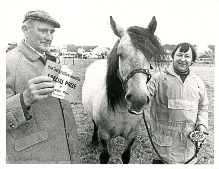 1979 - Highland Ponies judge George Baird presents the Champion Highland Pony in show to Lorna with Stanley Leslie looking on. 