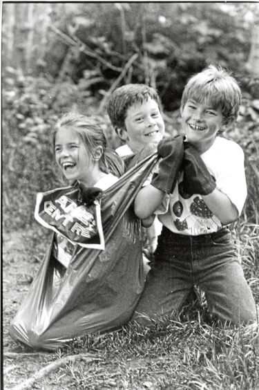 1993 - Emma Coull, Mark Goonan and Stewart Graham fool around during a litter picking. 
