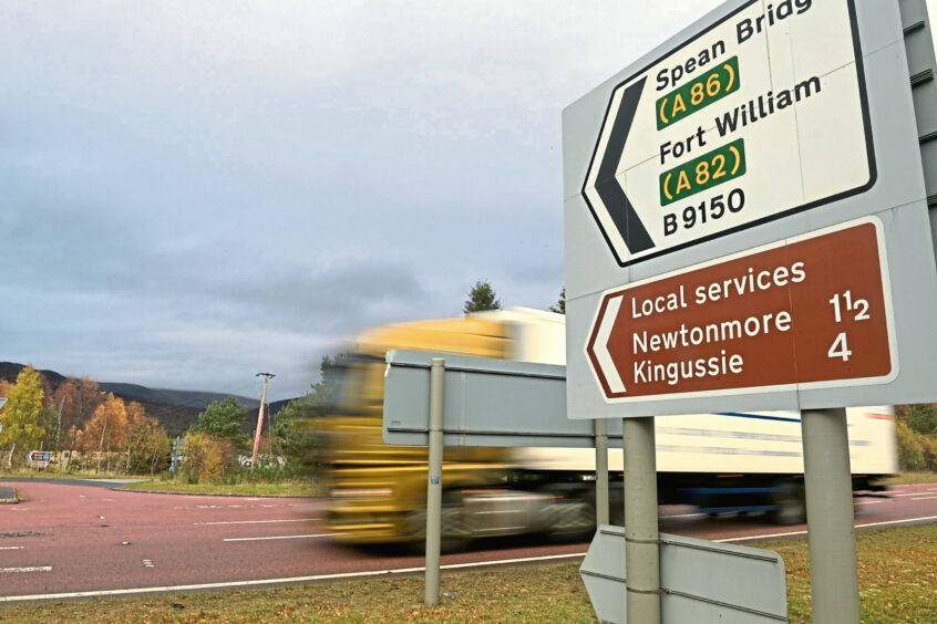 Road signs on the A9 for the turn off for Spean Bridge and Fort William. 