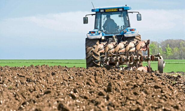 Tractor ploughing field. Image: Shutterstock